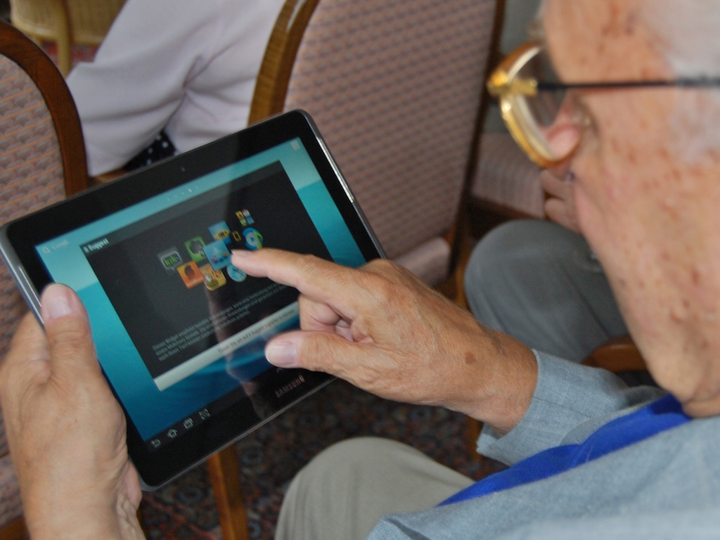 Old man using a tablet